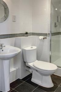 a bathroom with a toilet and a sink and a shower at Sure Hotel by Best Western Aberdeen in Aberdeen