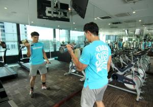 two men in a gym taking a picture of themselves at Pacific Express Hotel Central Market Kuala Lumpur in Kuala Lumpur +31 photos