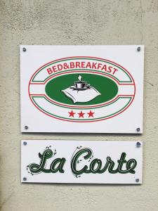 a sign for a red and break east la corniccolo at La Corte in Alessandria