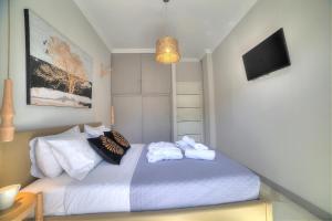 Posteľ alebo postele v izbe v ubytovaní Amazing apartment in Glyfada center + 30 fotografií