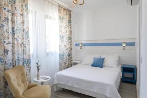Ένα ή περισσότερα κρεβάτια σε δωμάτιο στο Troas Ada Hotel
