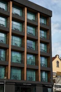 an apartment building with windows and balconies at Nôma Living Avenida 60 in Aveiro