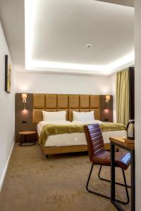 Ένα ή περισσότερα κρεβάτια σε δωμάτιο στο Charm Boutique Hotel