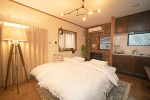 Cama o camas de una habitación en Jomira &Jony House