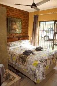 Postel nebo postele na pokoji v ubytování Umhlanga Kruger