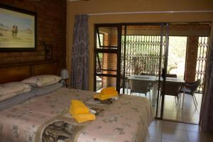 A bed or beds in a room at Umhlanga Kruger