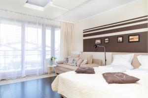 Posteľ alebo postele v izbe v ubytovaní Apartamenty Villa Marea Misdroy by Noclegi Renters