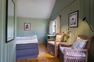 A bed or beds in a room at Håholmen - by Classic Norway Hotels