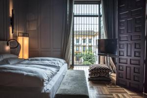 Postel nebo postele na pokoji v ubytování CoolRooms Palacio Villapanés 5 GL