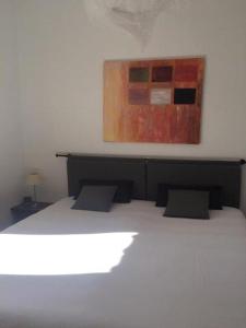 En eller flere senge i et værelse på Casa Laguna ET0490