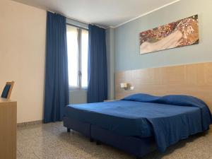Postel nebo postele na pokoji v ubytování Hotel Santa Giulia