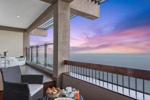 a balcony with a view of the ocean at Amagi Aria Airport Transit Hotel in Negombo