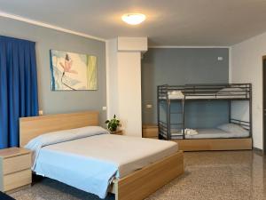 Postel nebo postele na pokoji v ubytování Hotel Santa Giulia