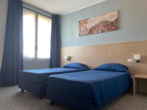 Postel nebo postele na pokoji v ubytování Hotel Santa Giulia