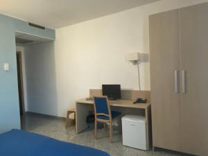 TV a/nebo společenská místnost v ubytování Hotel Santa Giulia