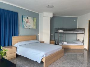 Postel nebo postele na pokoji v ubytování Hotel Santa Giulia