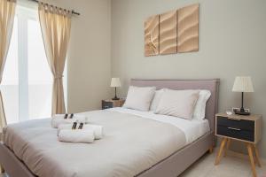 a bedroom with a large bed with towels on it at Angel-kolymvari4you in Kolymvari