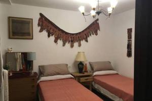 Katil atau katil-katil dalam bilik di Casa de Plaza Candelaria Rooms