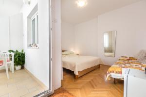 Postel nebo postele na pokoji v ubytování Villa Roko