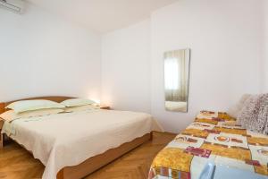 Postel nebo postele na pokoji v ubytování Villa Roko