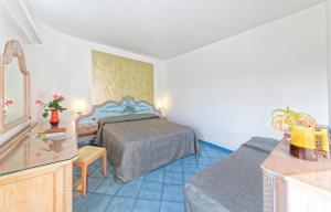 a small bedroom with a bed and a sink at Hotel San Giorgio Terme in Ischia
