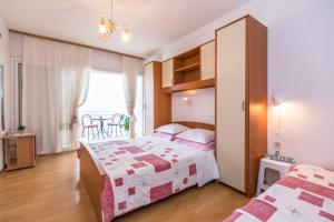 Postel nebo postele na pokoji v ubytování Villa Roko