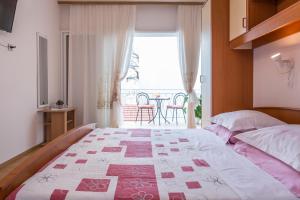 Postel nebo postele na pokoji v ubytování Villa Roko