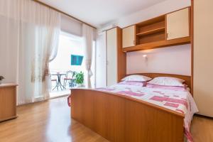 Postel nebo postele na pokoji v ubytování Villa Roko