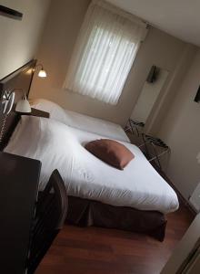 Postel nebo postele na pokoji v ubytování Ambiance Hotel