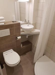 Koupelna v ubytování Ambiance Hotel