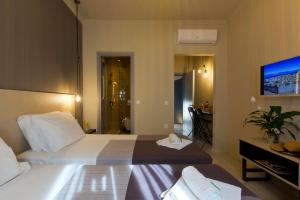 Katil atau katil-katil dalam bilik di LOC HOSPITALITY Urban Suites