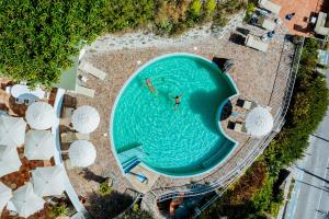 an overhead view of two people in a swimming pool at Hotel San Giorgio Terme in Ischia