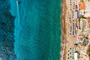 an overhead view of a beach and the ocean at Hotel San Giorgio Terme in Ischia