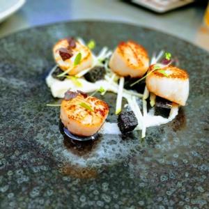 a plate with some food on top at Port Charlotte Hotel in Port Charlotte