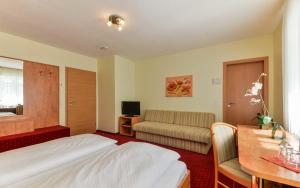 Postel nebo postele na pokoji v ubytování Hotel Kirchhainer Hof