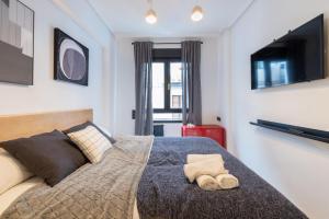 Łóżko lub łóżka w pokoju w obiekcie Marzana by Staynnapartments