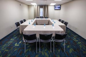 a conference room with a large table and chairs at Candlewood Suites New Braunfels, an IHG Hotel in New Braunfels