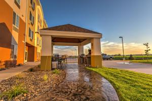 a gazebo in front of a building at Candlewood Suites Sidney by IHG in Sidney