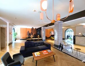 TV a/nebo společenská místnost v ubytování Iliria Boutique Hotel