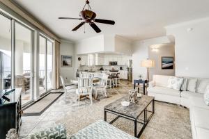 a living room with a couch and a table at Dunes of Seagrove Condos in Santa Rosa Beach