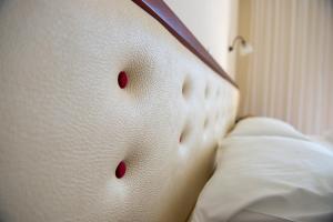 Postel nebo postele na pokoji v ubytování Dionisos Hotel