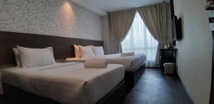 Voodi või voodid majutusasutuse MIICO Hotel @ Mount Austin toas