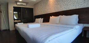 Voodi või voodid majutusasutuse MIICO Hotel @ Mount Austin toas