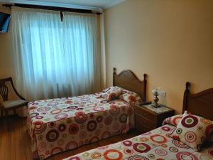 Кровать или кровати в номере Habitaciones Vistamar