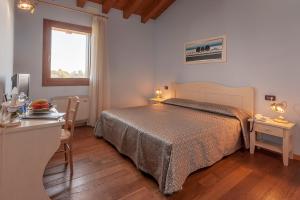 Giường trong phòng chung tại Le Favole Agriturismo