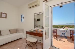 a living room with a couch and a table at Mateus Studios in Plaka