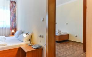 Postel nebo postele na pokoji v ubytování Hotel Kirchhainer Hof