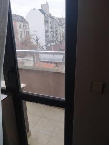 a view from a door looking out at a window at Apartment Ivaylo in Varna City +15 photos