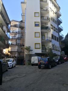 a parking lot in front of a tall building at Sorrento's Holidays Room 1 in Sorrento