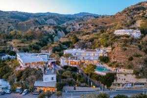 an aerial view of a resort with mountains in the background at Hotel San Giorgio Terme in Ischia